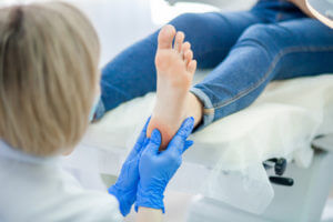 podiatrist treats foot